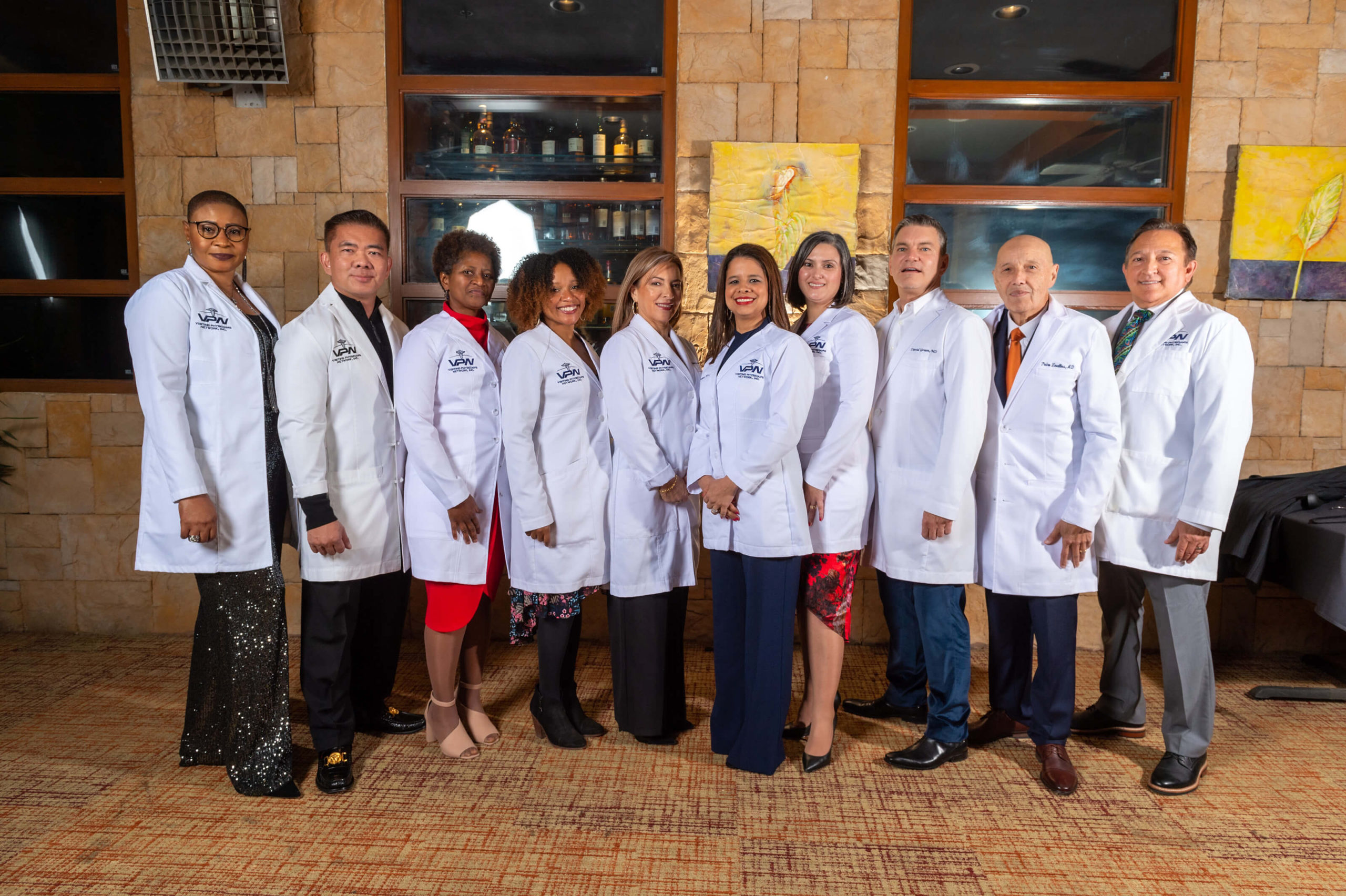 A group of doctors standing in front of a building.